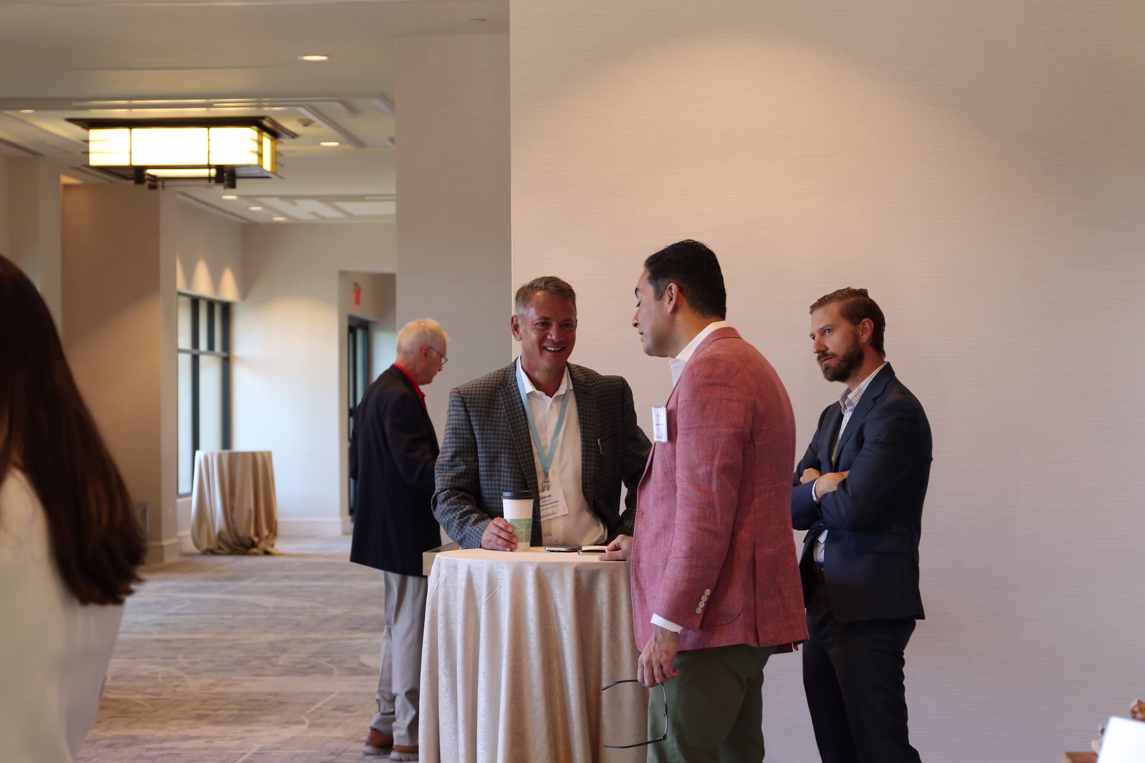 Healthcare executives discussing donor strategy at a philanthropy healthcare leadership conference.