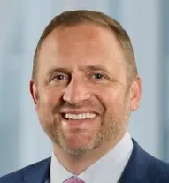 A headshot of Chris Watts