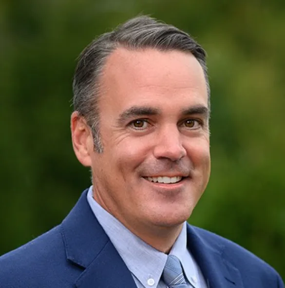 A headshot of Patrick McGill