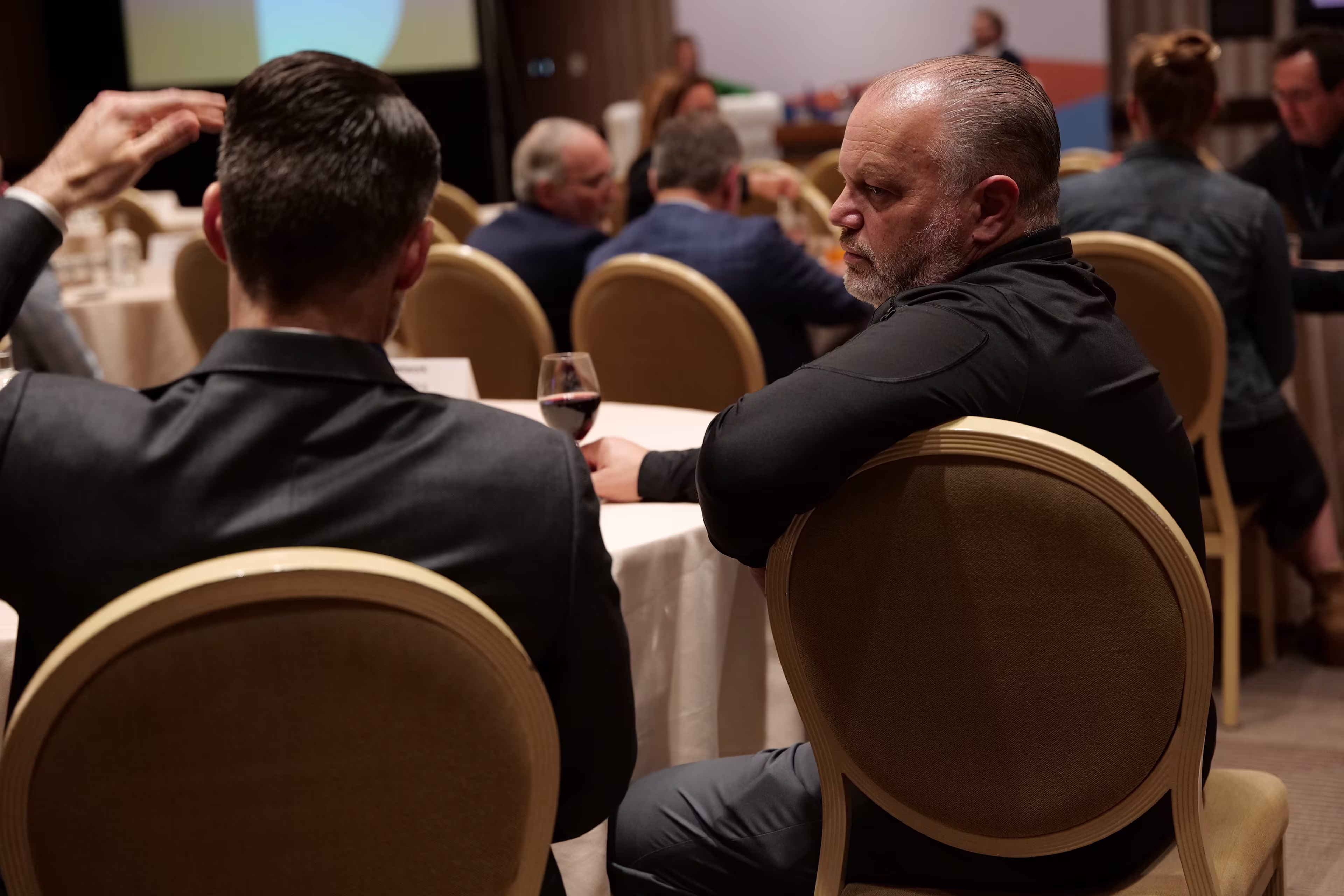 Healthcare CSCOs engaged in intimate conversation at the supply chain healthcare conference