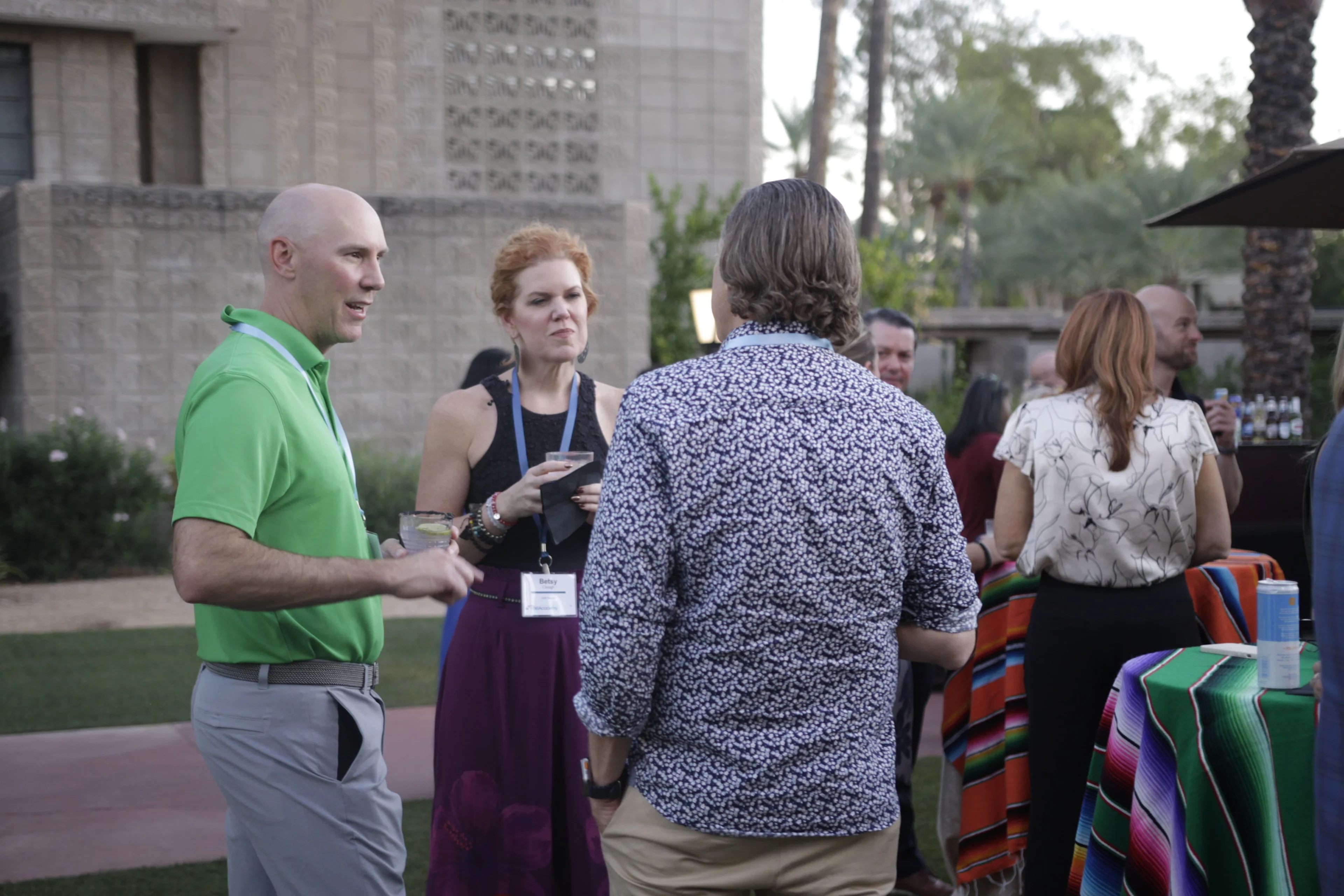 Health system executives conversing at a healthcare analytics conference