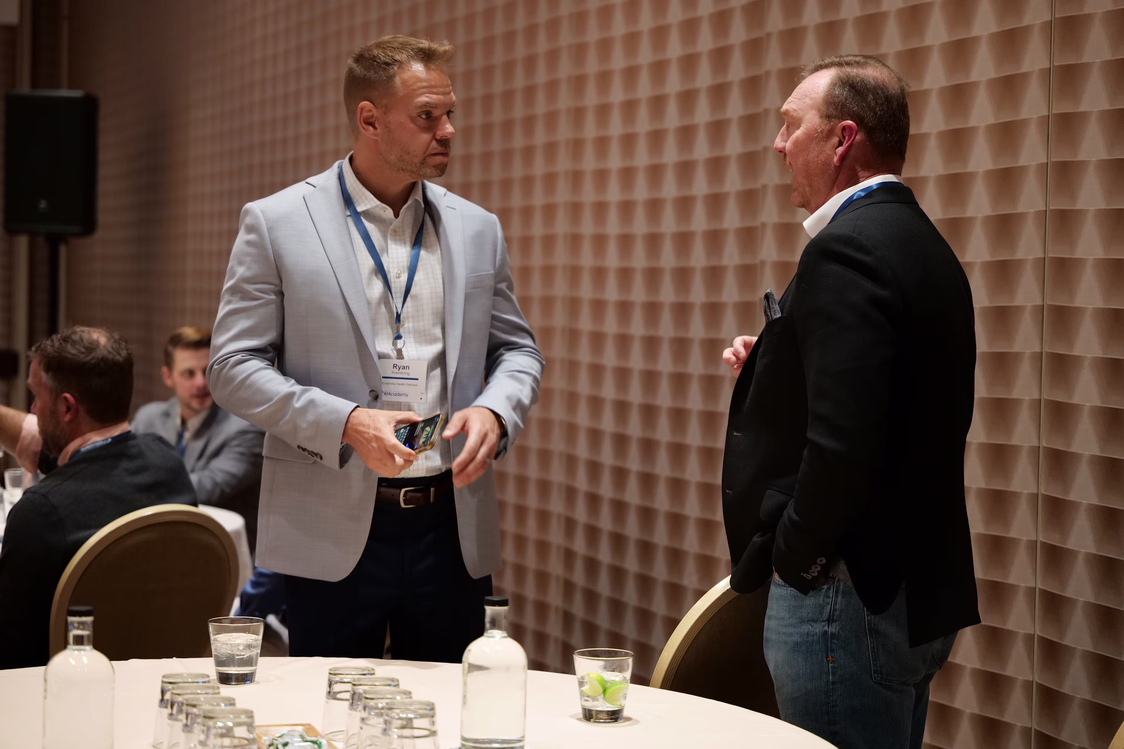 Two supply chain conference attendees talking between sessions