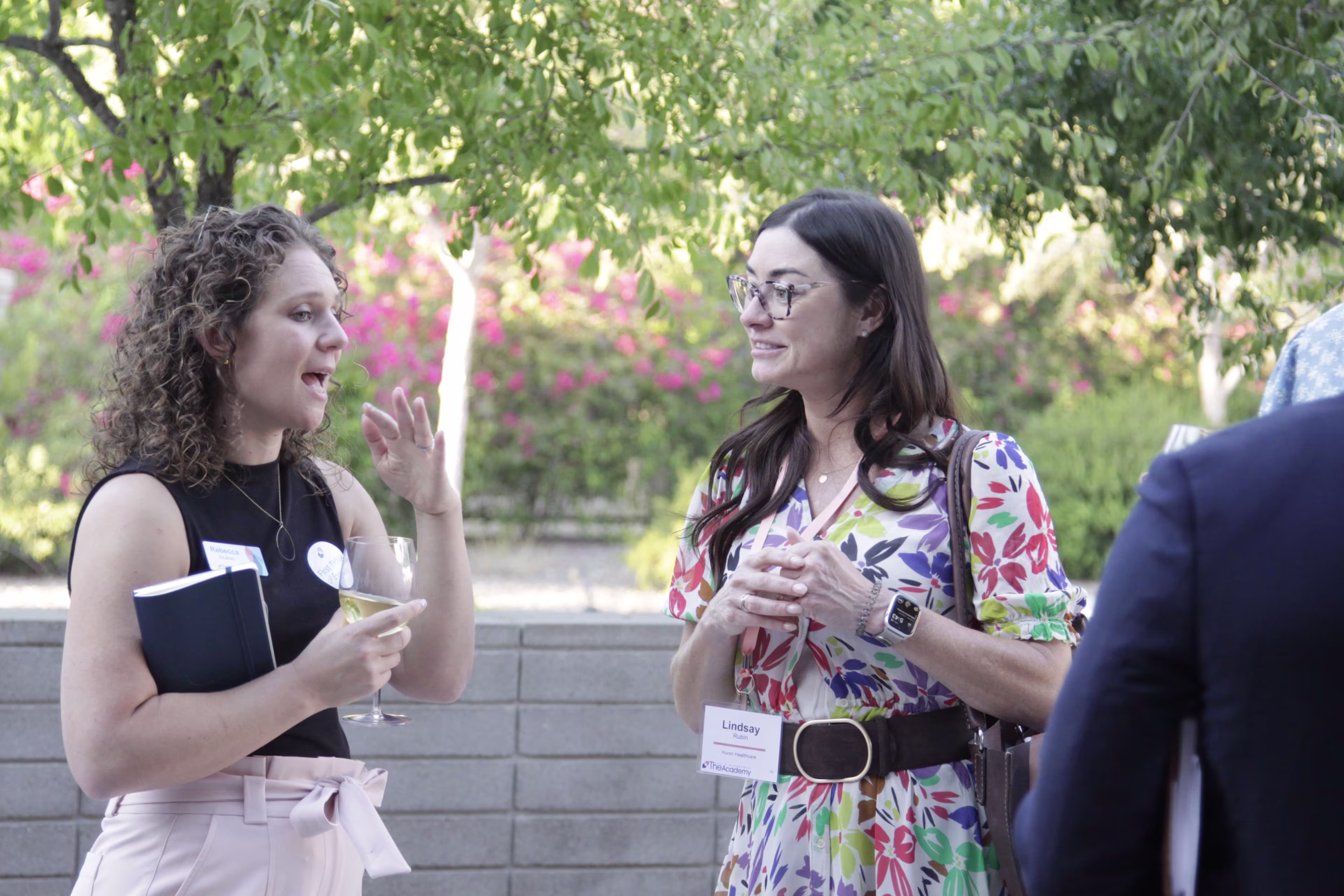 Orthopedic conference discussion among health system leaders and industry executives in a collaborative forum setting.