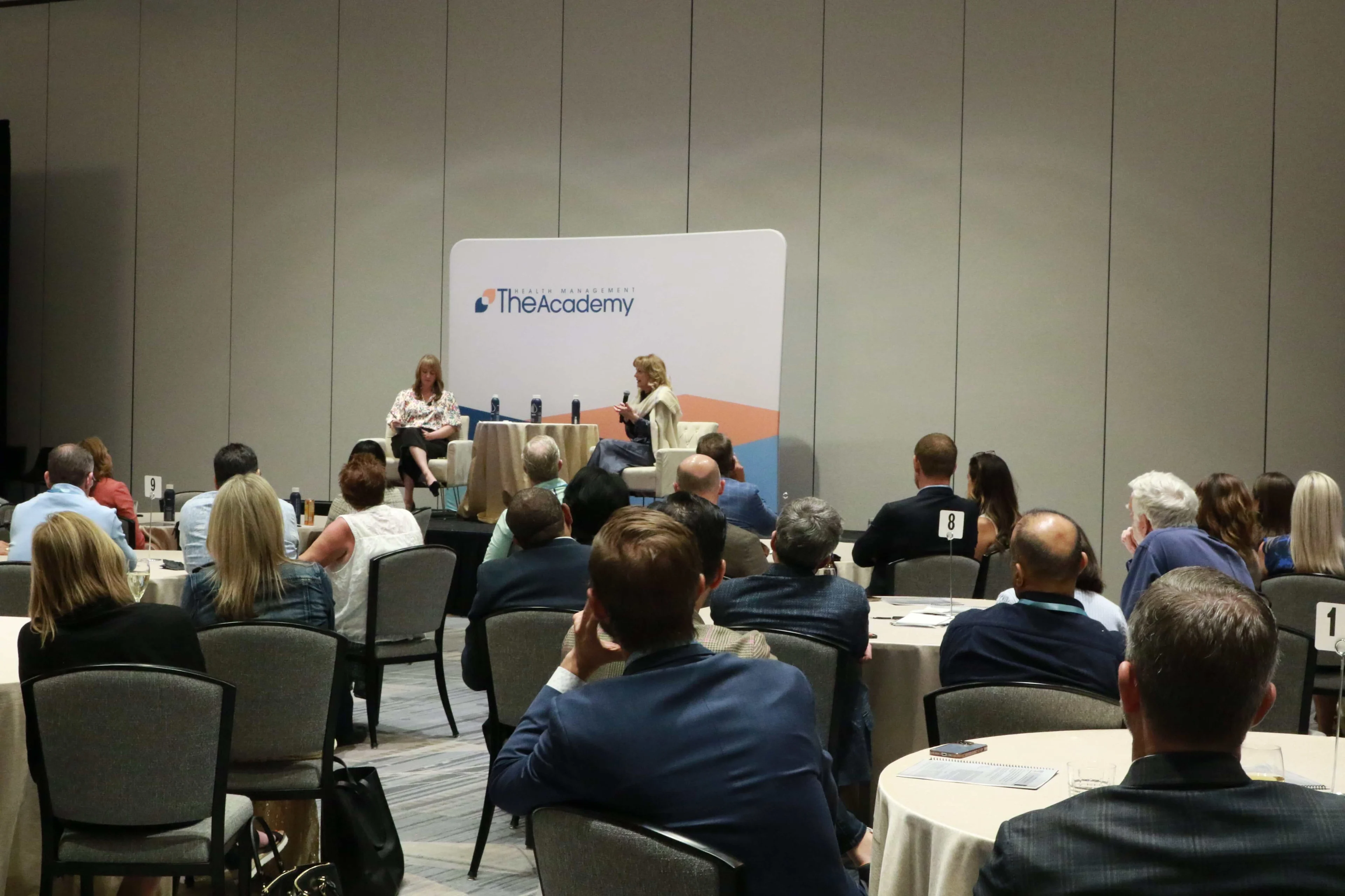 Members listening to a THMA Fireside Chat at a healthcare conferece