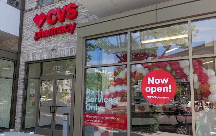 A photo of the outside of a new pharmacy-only CVS, with signage advertising the new store type.