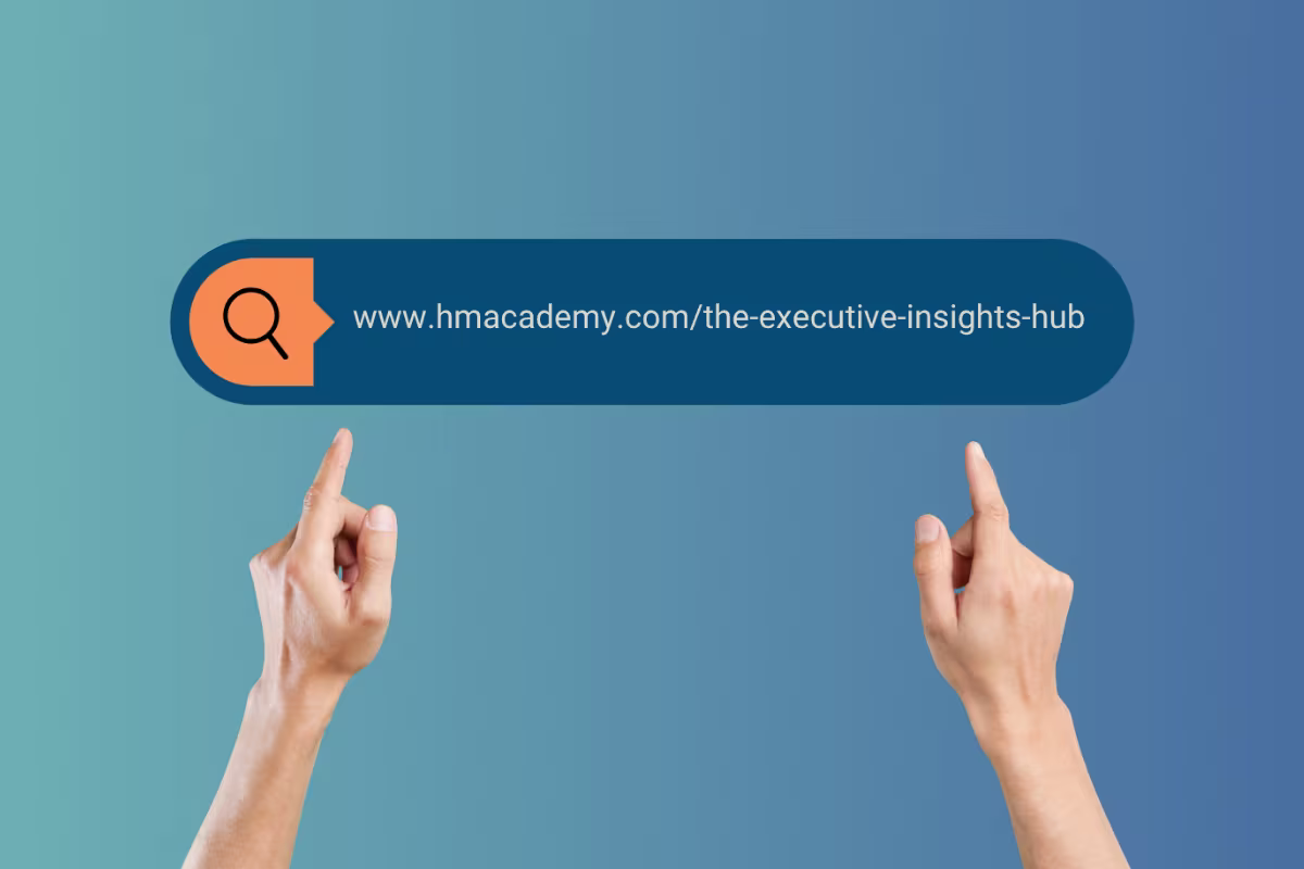 Two hands point upward toward a search bar graphic displaying the URL “www.hmacademy.com/the-executive-insights-hub” on a blue gradient background, with an orange magnifying glass icon on the left.

