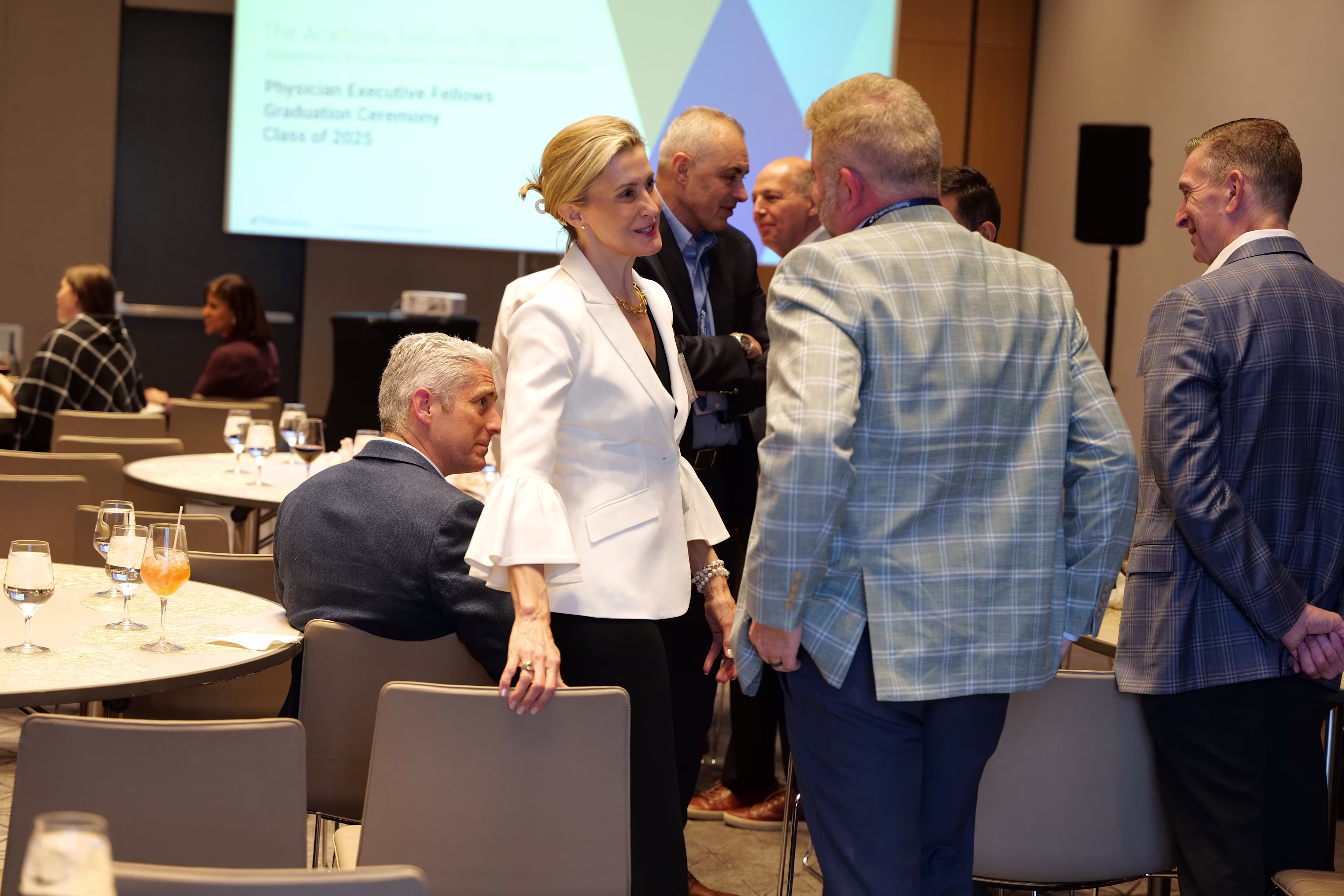 Attendees conversing at the Chief Nursing Executive Forum
