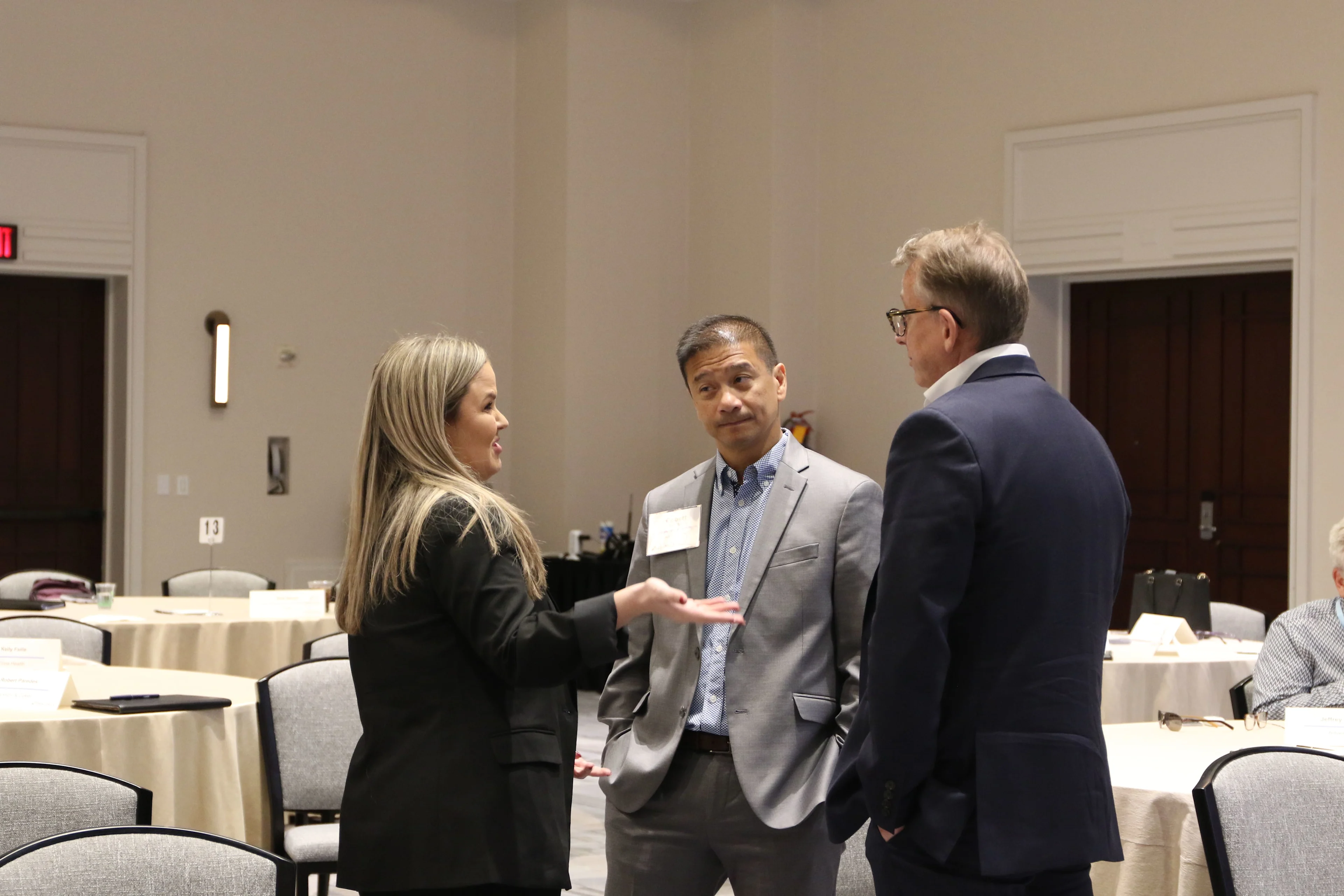 Candid peer-to-peer conversation between oncology service line executives at an oncology conference