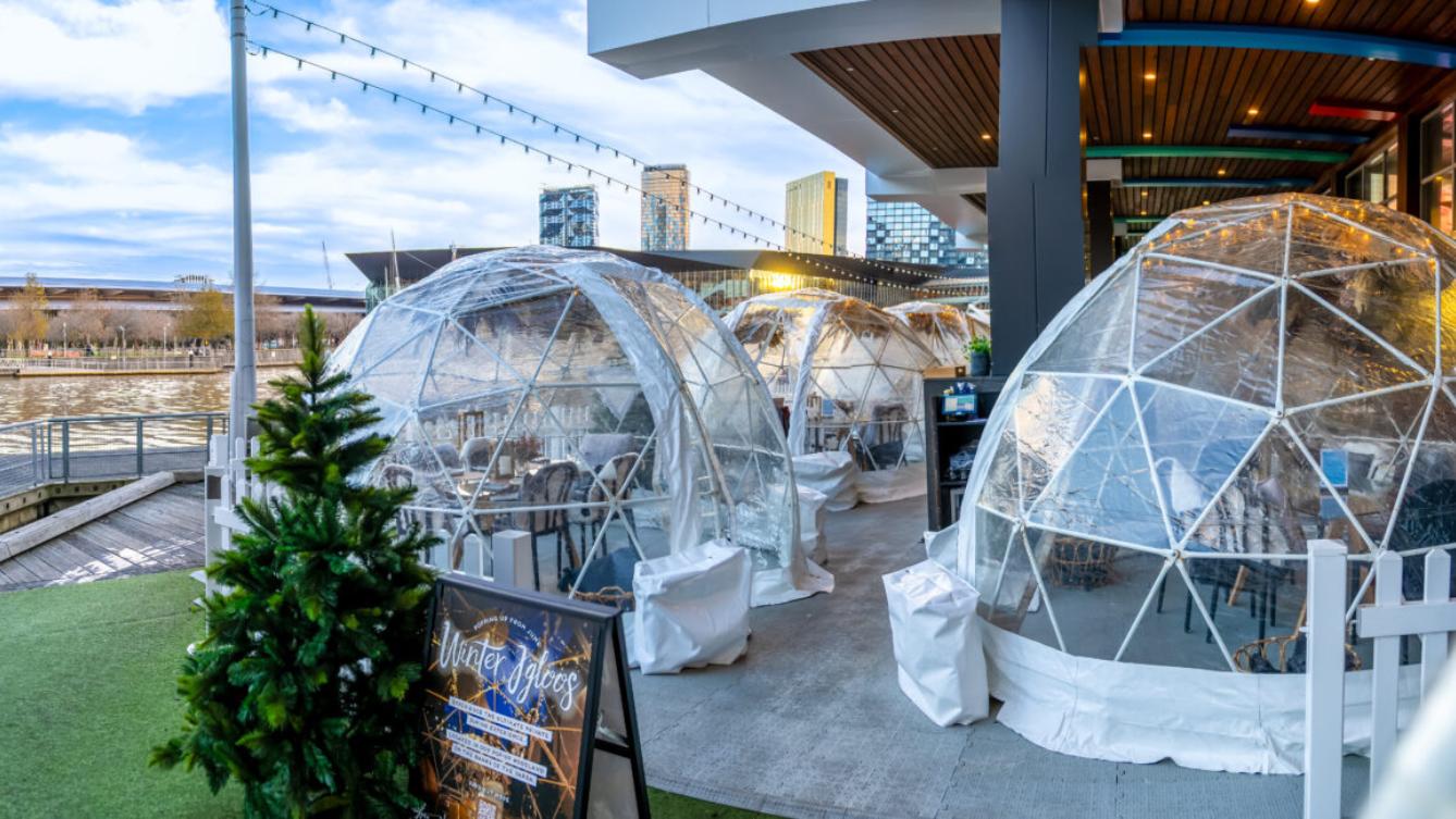 Iconic winter igloos outside at the Wharf Hotel Melbourne looking out at the Yarra River. 