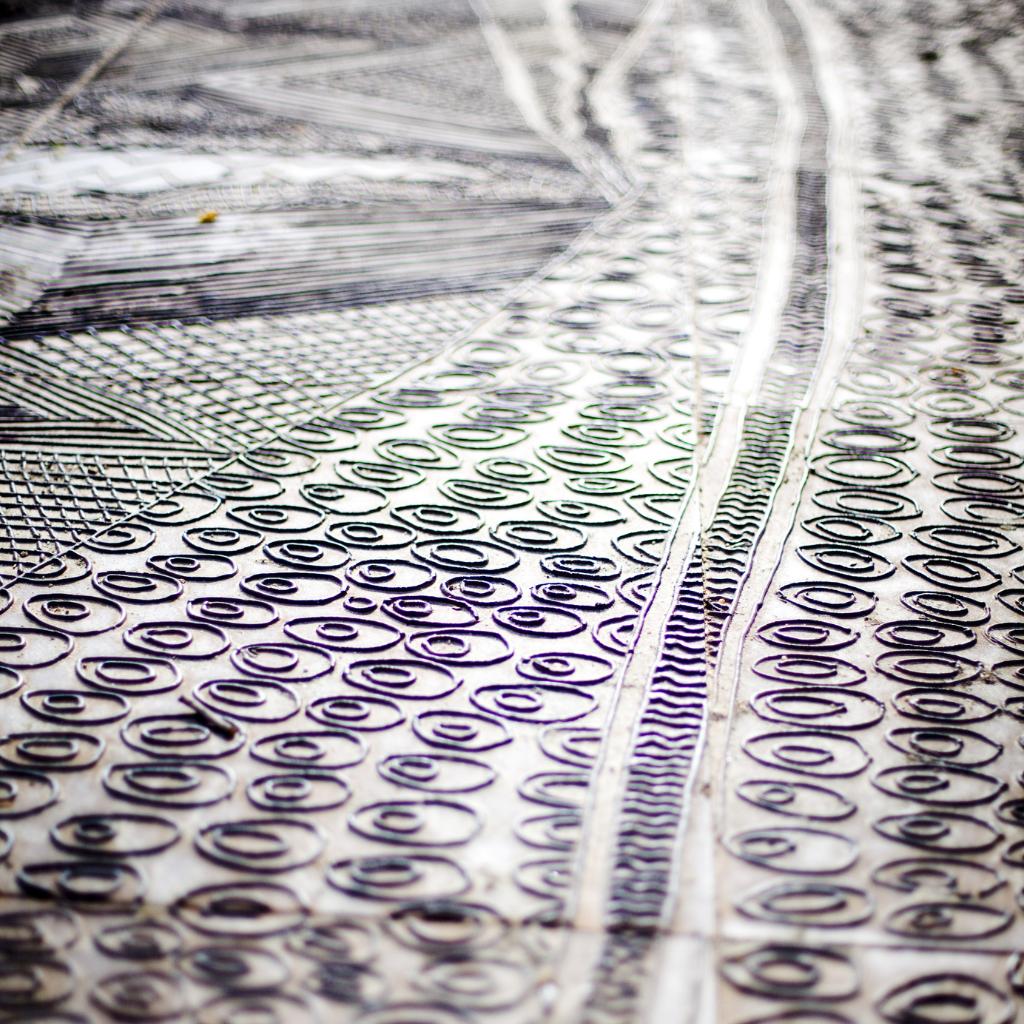 Close up of Aboriginal rock carving at Birrarung Marr.