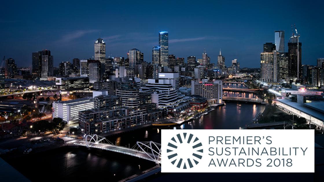 Birds eye view of the Melbourne Convention and Exhibition Centre at night with the 2018 Premier's Sustainability Awards badge overlayed on the bottom right corner of the image. 