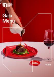 Cover image of the MCEC gala menu. A hand pours a liquid onto a large piece of meat, presented on a red plate. 