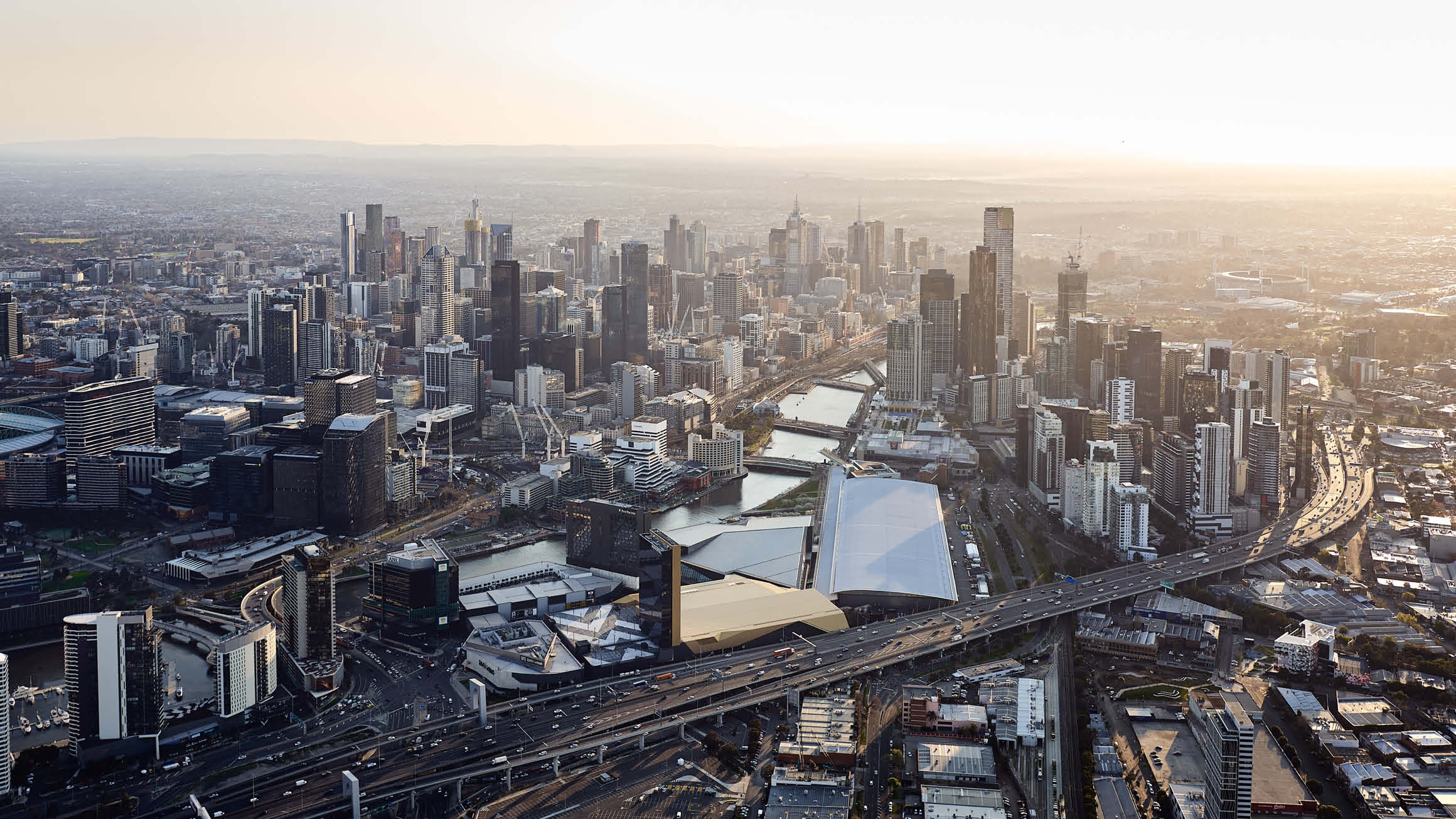 Bird's eye view of the city with the Melbourne Convention and Exhibition Centre at the centre of the image. 