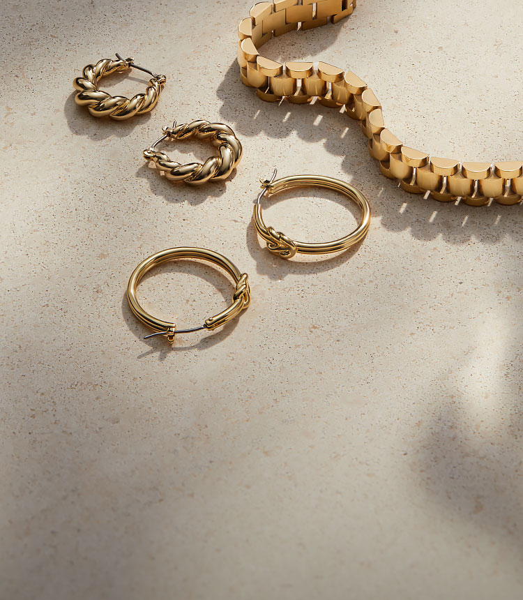 gold hoop earrings and gold chain bracelet