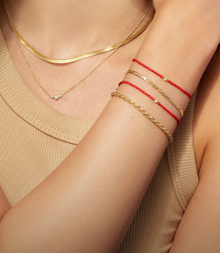 stacked gold chain bracelets