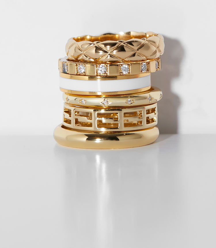 stacked gold rings with gemstones