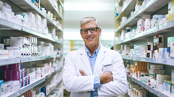 pharmacist standing in pharmacy