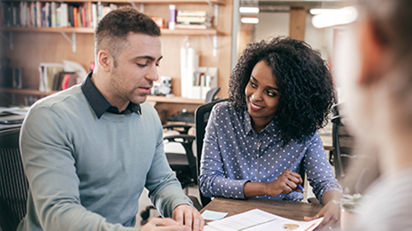 man and woman looking through paperwork