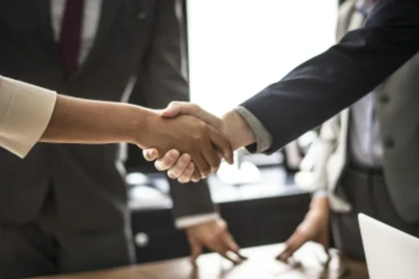 Code of Conduct image of a business handshake