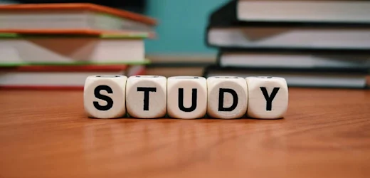 STUDY dice blocks with books, symbolising choosing between a Diploma and Certificate IV for career growth