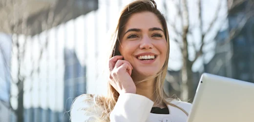 Young woman is on a phone and is making calls to see what high paying jobs she can start with little experience