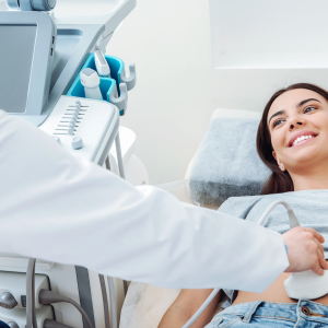 Pregnant woman receiving an abdominal ultrasound