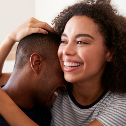 Happy couple with positive pregnancy test