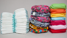 Image of two stacks of disposable diapers and two stacks of cloth diapers