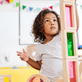 Small child building a tower