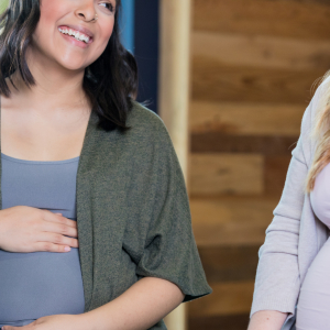 Two pregnancy women laughing