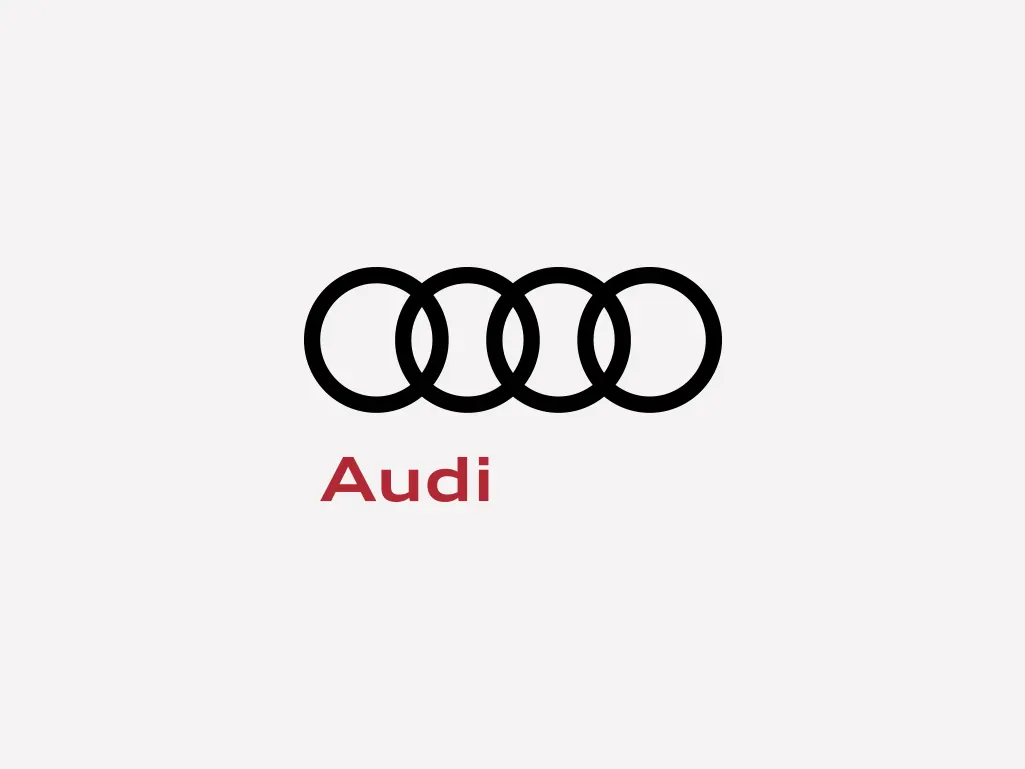 Audi Marke Ein Logo einer Fahrzeugmarke auf hellgrauem Hintergrund.