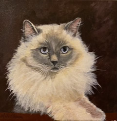 Painting of a cat on a brown background