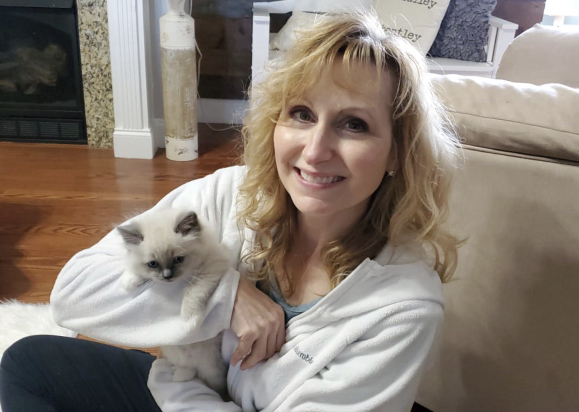 Image of artist with cat