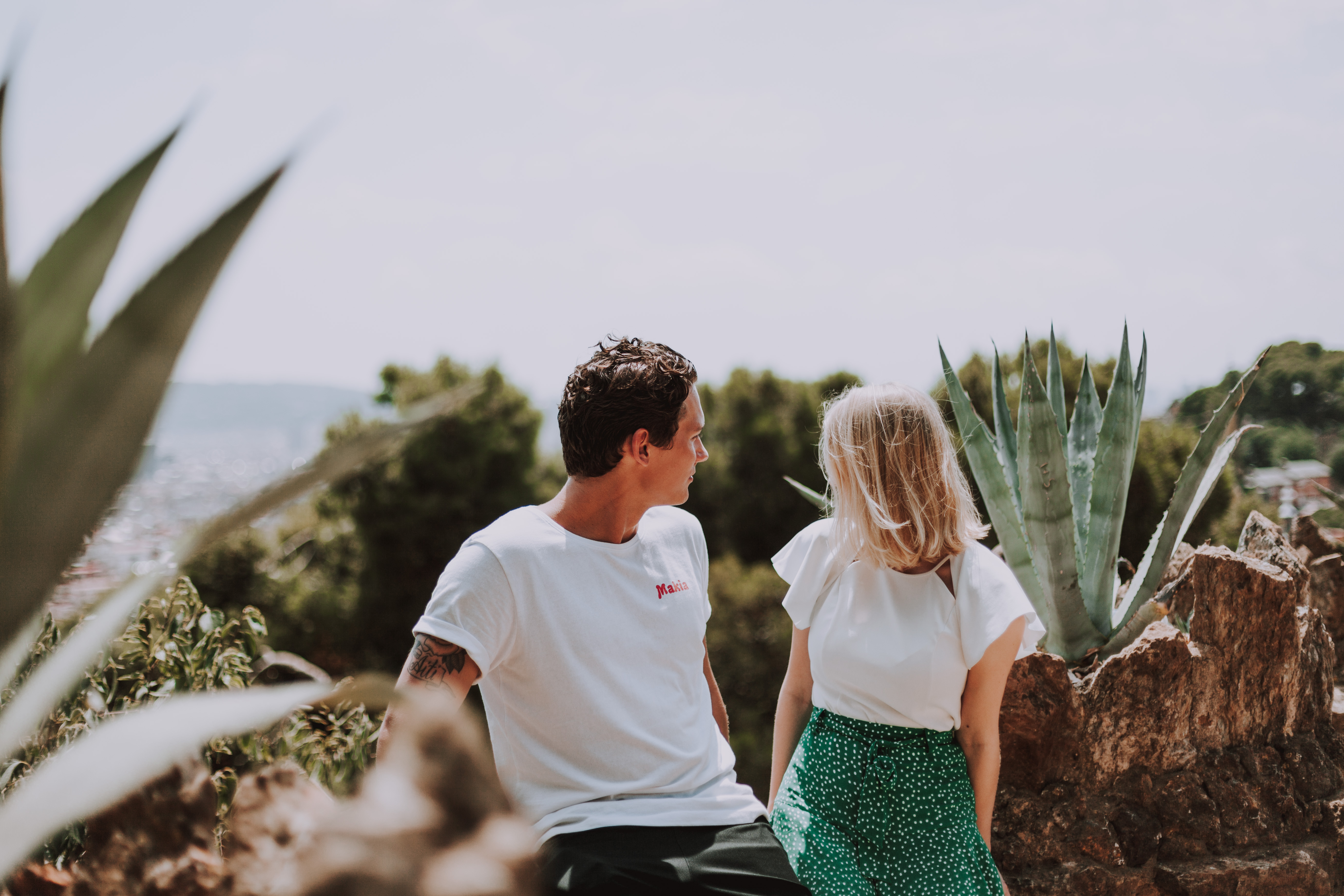 Couple in park de guell in Barcelona Spain looking at the view
