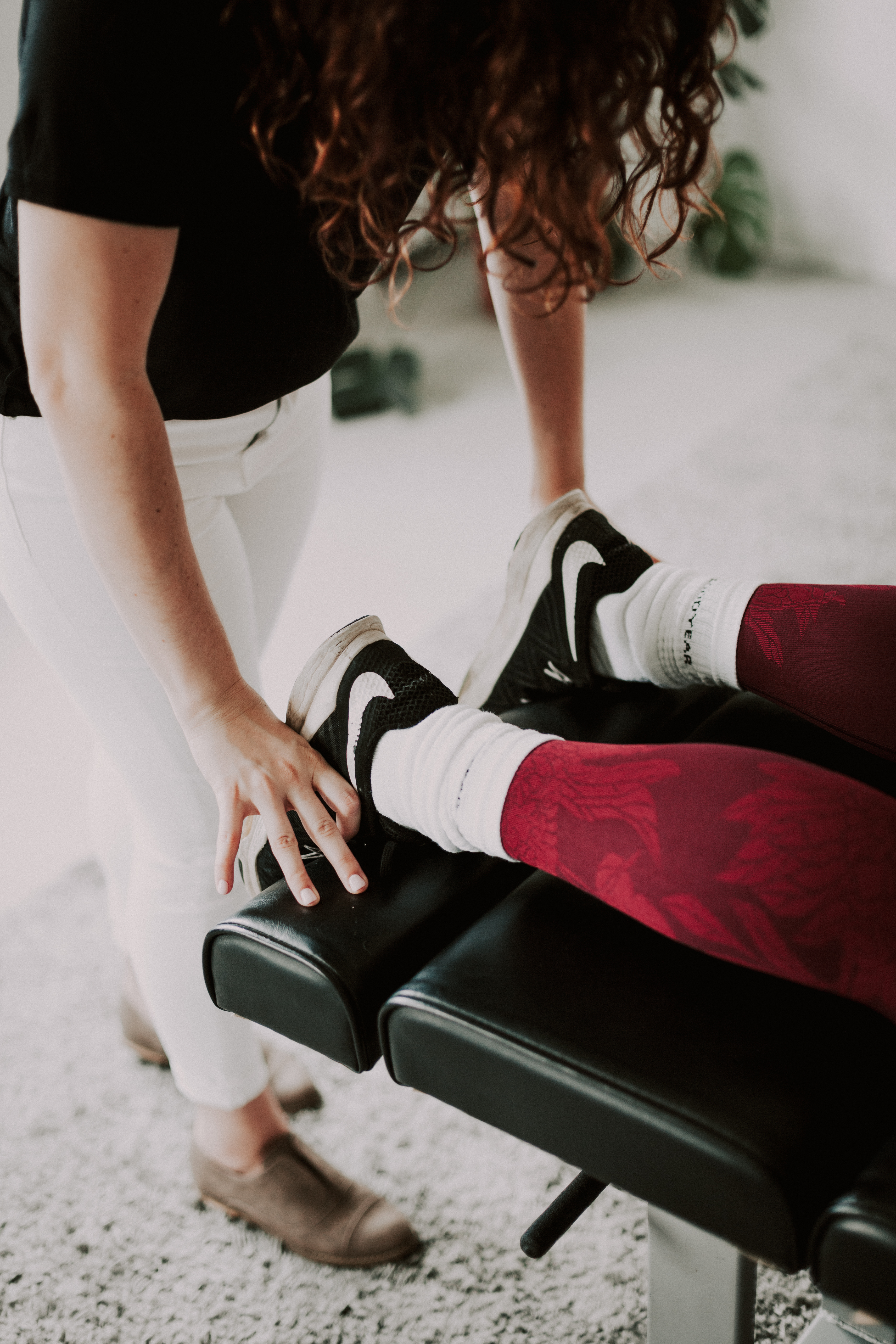 Illumminate chiropractic studio's chiropractor Kelli Turelli adjusting a patient in Barcelona Spain