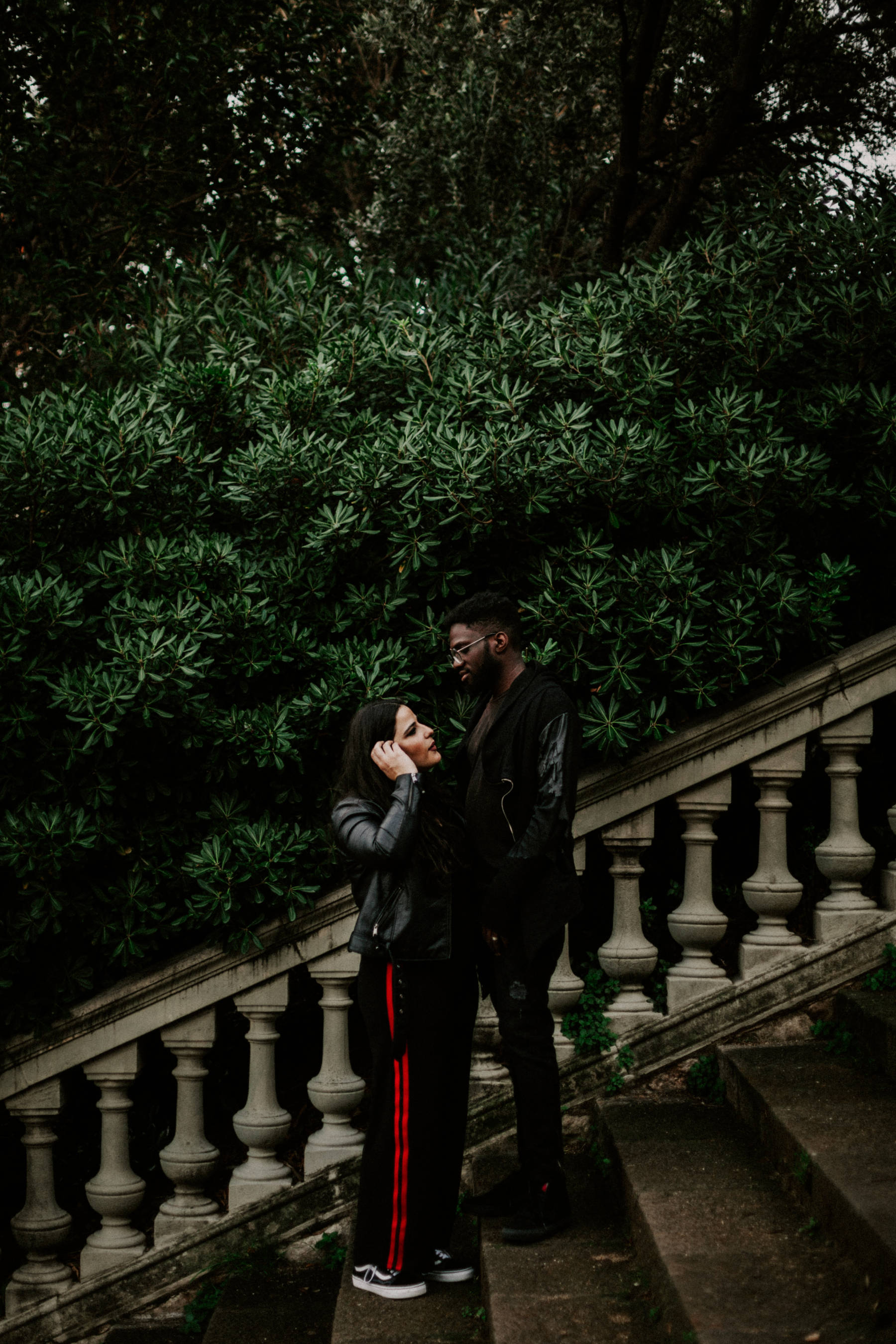 A couple standing on the stairs of Montjuic castle, Barcelona Spain