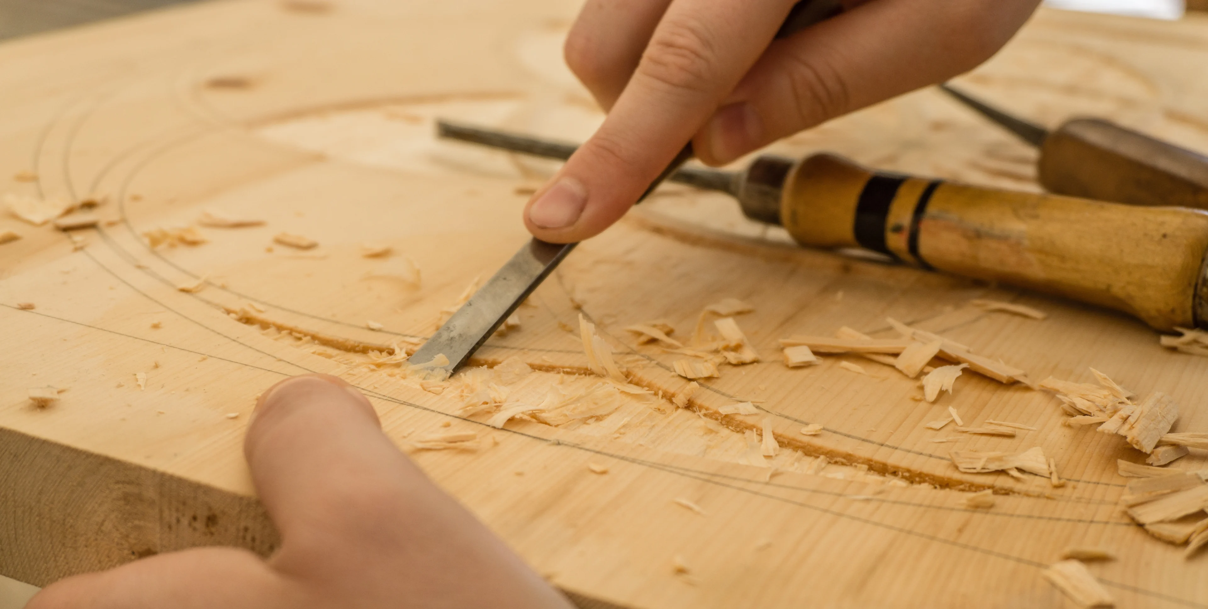 Person chiseling wood