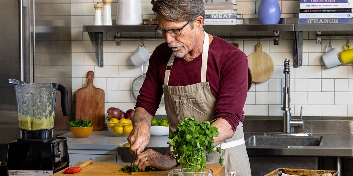 Chef Rick Bayless chopping herbs