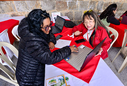 women sitting in front of a computer
