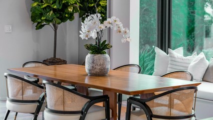 Modern dining table with greenery