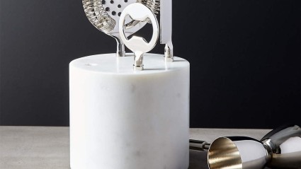 a white cylinder with metal objects on it