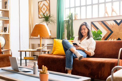 Woman on couch with phone