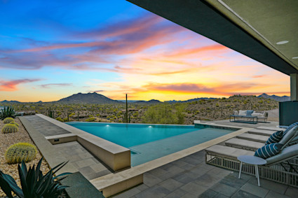Desert Haven's hillside pool and mountain views highlight the appeal of Scottsdale's clear winter nights.