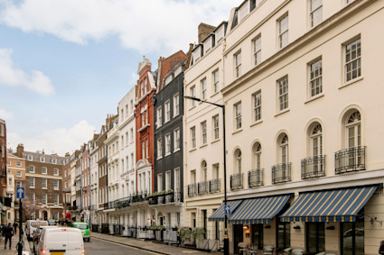 Stunning exterior view of a luxury penthouse at 4-5 Queen Street, Mayfair, London, highlighting contemporary architecture and prime urban location