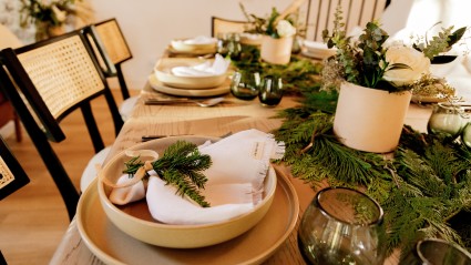  Holiday dinner table adorned with greenery and elegance at a Lake Arrowhead second home