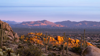 Cacti and rocky mountains cover the wilderness surrounding Scottsdale, Arizona, embodying why it’s one of the best places for a second home.