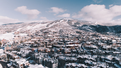 Aerial view of a ski town covered in snow