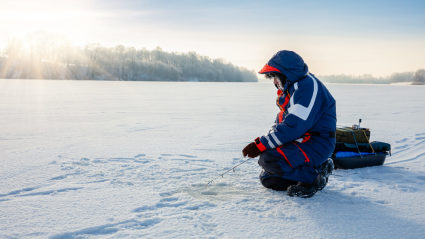 A photo of someone ice fishing, one of the many empty nest ideas to try.