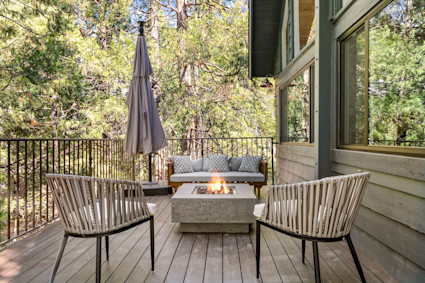 The expansive deck and fire pit at West Shore in Lake Arrowhead are the perfect stage for cozy outdoor dinners and laughter-filled evenings under the trees. Direct water access and lake vistas boost the appeal for any host.
