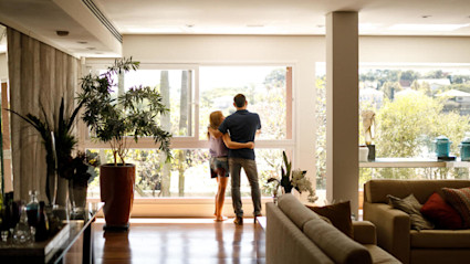 A couple contemplates how to begin financing a vacation home.